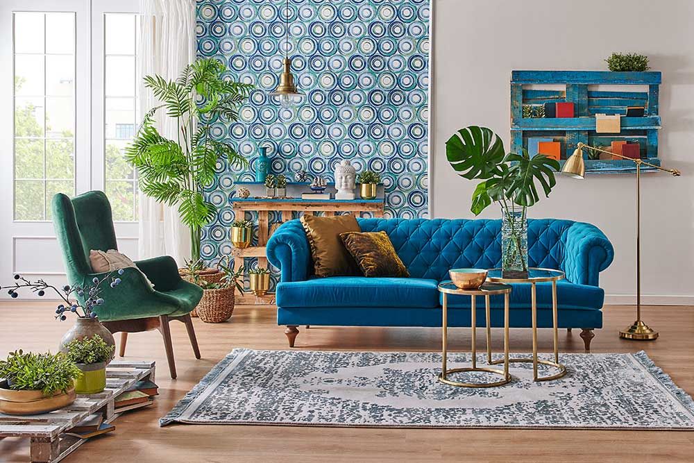 Blue wallpaper and sofa furniture style, decorative wooden palette bookshelf, gold lamp and middle table, vase of green plant, carpet and city view background.